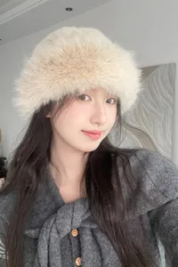Stylish women's fluffy faux fur bucket hat, perfect cozy winter fashion accessory.