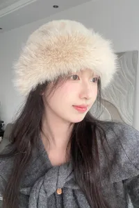 Cozy fluffy winter bucket hat for women, soft plush warm faux fur cap detail view.