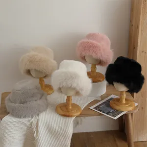 Cozy plush faux fur bucket hat for women winter chic warm trendy fuzzy fisherman cap style.