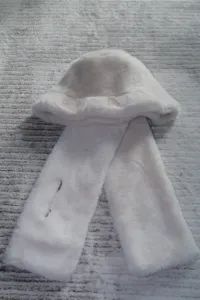 Soft white plush winter bucket hat and scarf set detail, thick warm faux fur cap with pocket.