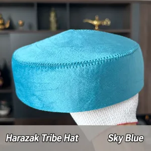 Detailed view of the turquoise velvet Kazakh ethnic hat, showing fine stitching texture clearly.