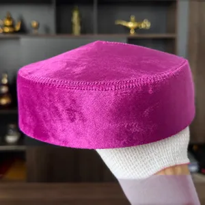 Detailed view of traditional purple velvet Kazakh hat, ethnic folk style headwear for women.