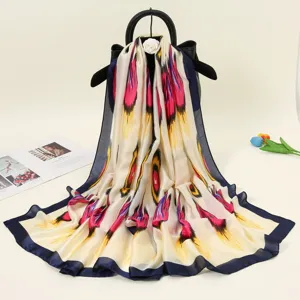 Silk satin long scarf featuring ethnic atlas floral print, elegant accessory for all seasons.