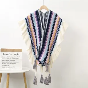 Ethnic style knitted poncho shawl with ruffles and tassels, warm geometric wave winter wrap.
