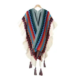 Ethnic style knitted long poncho with ruffles and tassels, warm winter travel cape coat.