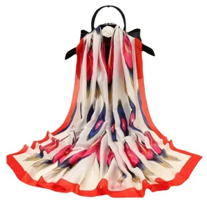 Stunning satin silk long scarf featuring vibrant abstract feather print and elegant red border.