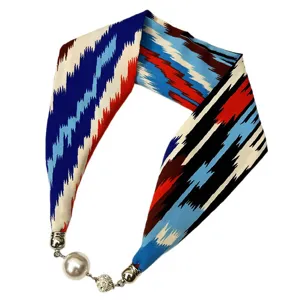 Ethnic ikat pattern silk scarf necklace with elegant pearl magnetic clasp for women fashion.
