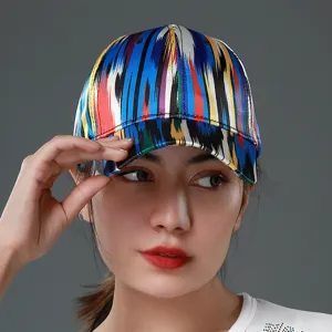 Ethnic style colorful striped baseball cap detail shot, vibrant silk fabric sun hat for women.