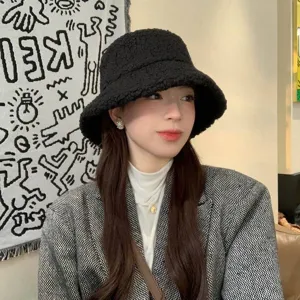 Winter black fuzzy bucket hat for women, cozy lamb wool plush basin cap, stylish daily wear.