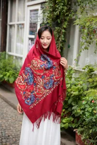 Detailed view of women's winter paisley embroidered warm shawl, ethnic style fringe scarf.