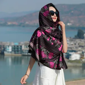 Detail of autumn winter ethnic floral jacquard tassel scarf scenic outdoor wear view.