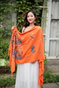 Detailed view of the autumn winter ethnic paisley embroidered orange cashmere feel shawl scarf.