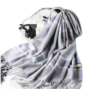 Draped grey plaid cashmere-feel winter scarf with fringe and stylish herringbone pattern.