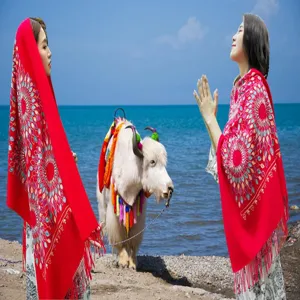 Detailed view of the ethnic style embroidered winter cashmere-feel scarf with lovely floral tassel design.