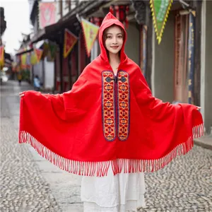 Red hooded cape shawl with ethnic embroidery and horn buckles, bohemian winter warm outerwear.