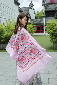 Detail view of women ethnic pink embroidered cashmere-feel tassel shawl scarf, sunflower pattern.