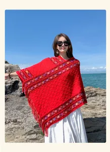 Red knitted poncho shawl for women, vintage ethnic fringe wrap, warm winter travel outer wear.