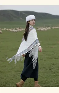 Boho ethnic knitted tassel shawl for women, warm winter cape and stylish travel outer wear.