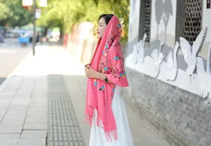 Detailed view of women pink cashmere embroidered shawl, ethnic floral scarf for autumn winter.