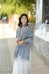 Exquisite embroidered cashmere scarf for women, warm winter shawl with ethnic floral design.