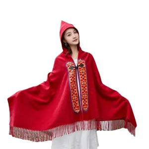 Red hooded ethnic cape shawl with horn buttons and tassels, bohemian style travel cloak.