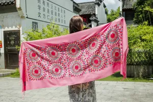 Pink cashmere feel embroidered shawl with vibrant floral mandala pattern and tassel hem design.