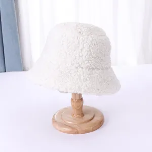 White fluffy sherpa bucket hat detail view, soft warm winter plush fisherman cap for women.