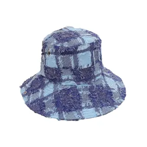 Classic blue patchwork frayed bucket hat for men and women, stylish sun protection outdoor cap.