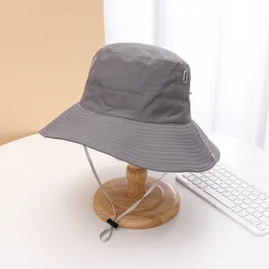 Grey outdoor quick-dry bucket hat detail shot, metal eyelets and adjustable chin drawstring.