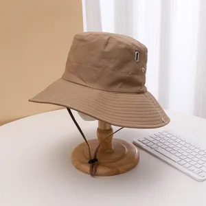Khaki quick-dry bucket hat for outdoor hiking, camping, and climbing with adjustable chin strap.