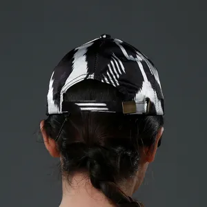 Classic black and white pattern baseball cap with adjustable metal buckle for outdoor wear.