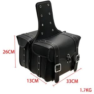 Motorcycle saddlebag detail view, waterproof leather tool storage bag with metal buckles.