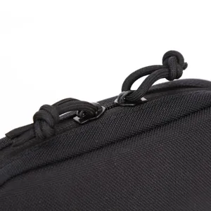 Close-up detail view of black tactical nylon utility pouch zipper and paracord pull loop.