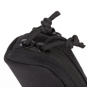 Detail shot of tactical nylon glasses case zipper and pull cord, durable outdoor accessory pouch.