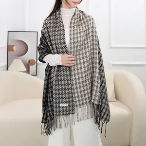Detailed shot of a houndstooth split-color cashmere-feel fringe winter warm shawl scarf.