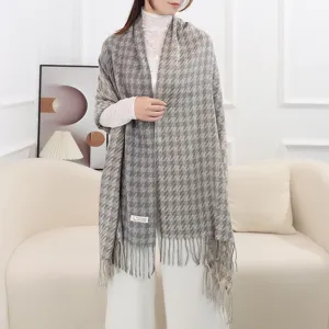 Detail view of grey houndstooth cashmere feel scarf featuring stylish fringe trim and warm shawl.