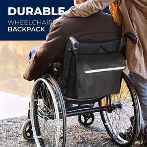 Detail view of durable black wheelchair backpack with reflective strip mounted on chair back.