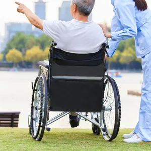 Detail of black wheelchair storage bag with reflective strip for outdoor mobility convenience.