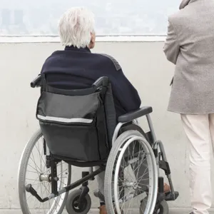 Wheelchair storage bag detail view, showing convenient back-hanging design and reflective strip.