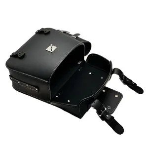 Detailed view of black motorcycle saddlebag with contrast white stitching and metal locks.