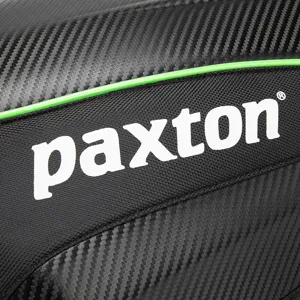 Carbon fiber motorcycle helmet backpack with green trim and paxton logo details.