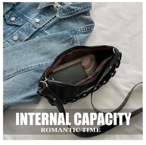 Black nylon underarm bag interior capacity detail view showcasing spacious storage space.