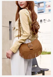 Stylish brown suede fringe saddle bag for women, retro crossbody shoulder bag for autumn.