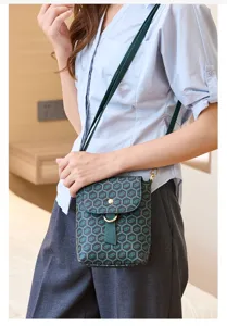 Peacock green vintage printed mini crossbody phone bag detail view showing compact size and strap.