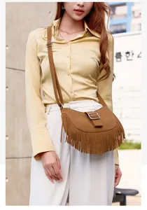 Vintage suede fringe saddle bag for women, stylish crossbody and shoulder bag for autumn fashion.
