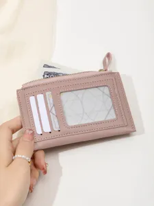 Pink women card holder wallet detail view, featuring multiple card slots, ID window and zipper.