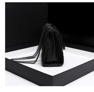 Black quilted leather chain shoulder bag detail view, classic stylish women messenger bag.