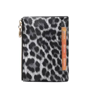 Details of the black and white leopard print short wallet, featuring gold zipper and card slot.