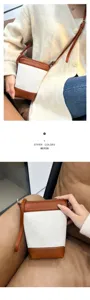 Retro color-block canvas crossbody bag for women, chic minimalist casual shoulder bag with zipper.