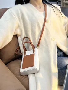 Minimalist color-blocked women's crossbody bag with pebble texture, stylish small tote purse for daily wear.